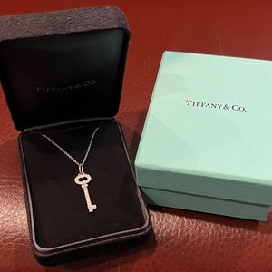 Retired Tiffany Platinum and Diamond Oval Key Pendant and Platinum Chain.